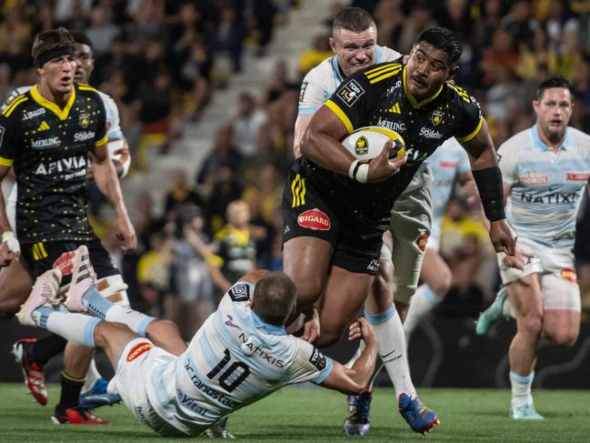 La Rochelle's Australian lock Will Skelton is tackled during the French Top14 rugby union match between Stade Rochelais (La Rochelle) and Racing 92 at The Marcel-Deflandre Stadium in La Rochelle, western France on June 8, 2024. (Photo by XAVIER LEOTY / AFP)