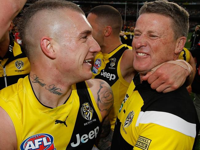 MELBOURNE, AUSTRALIA - SEPTEMBER 30: Dustin Martin of the Tigers and Damien Hardwick, Senior Coach of the Tigers celebrate during the 2017 Toyota AFL Grand Final match between the Adelaide Crows and the Richmond Tigers at the Melbourne Cricket Ground on September 30, 2017 in Melbourne, Australia. (Photo by Michael Willson/AFL Media/Getty Images)