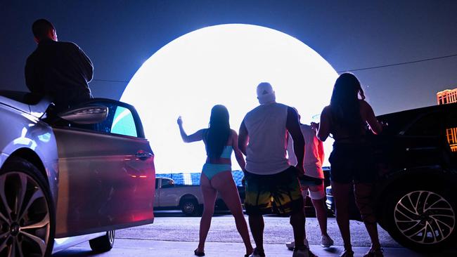 People dance outside the MSG Sphere. Photo by Patrick T. Fallon / AFP