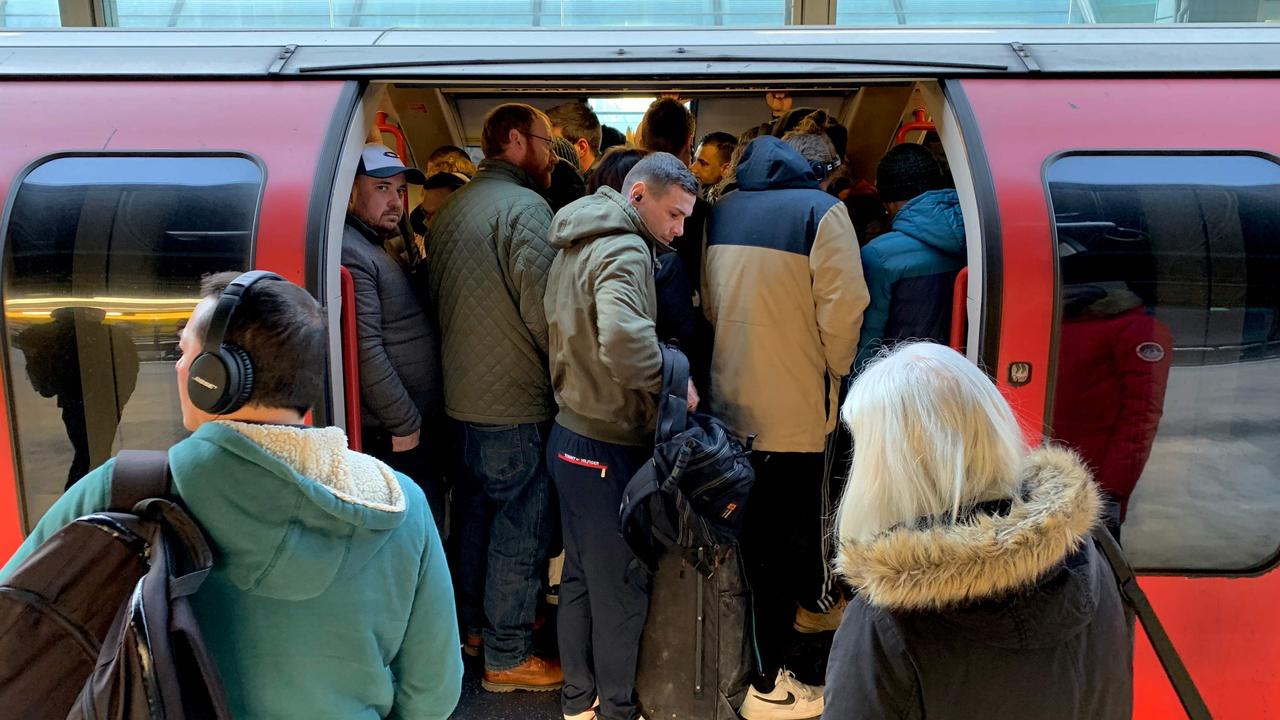 Passengers squeeze on to a London Underground train during the pandemic after Tube bosses cut services despite many people still commuting.