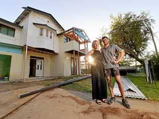 UNDER CONSTRUCTION: Mackay house-flippers Madison Strutynski and Michael Cotter at their Hunter St, West Mackay property. Picture: Stuart Quinn