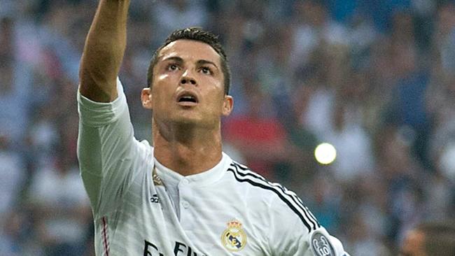 MADRID, SPAIN - MAY 13: Cristiano Ronaldo of Real Madrid celebrates after scoring the opening goal from the penalty spot during the UEFA Champions League Semi Final, second leg match between Real Madrid and Juventus at Estadio Santiago Bernabeu on May 13, 2015 in Madrid, Spain. (Photo by Gonzalo Arroyo Moreno/Getty Images)