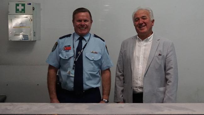 Chief Inspector Craig Ireland with former Cabramatta Patrol Commander Alan Leek as they stand behind the dusty desk of the Police Station.