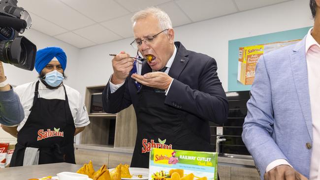 Scott Morrison samples products during a tour of Sabrini Foods in Carrum Downs. Picture: Daniel Pockett