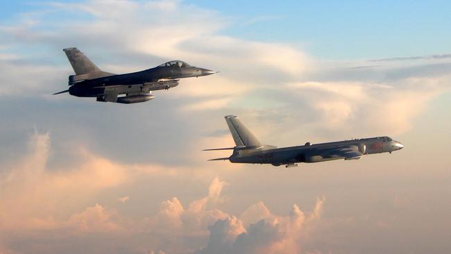 Chinese incursions into Taiwan’s air defence zone have been occurring on almost a daily basis. This photo shows a Taiwanese fighter jet (left) monitoring a Chinese bomber. Picture: Taiwan Defence Ministry/AFP