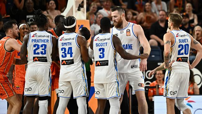 Aron Baynes of the Bullets is held by teammates during the clash. Picture: Emily Barker/Getty Images