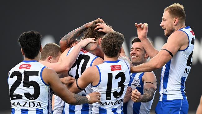 The Kangaroos celebrate one of Nick Larkey’s nine goals. Picture: Steve Bell/Getty Images