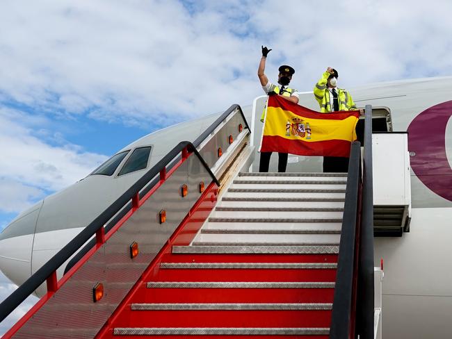 The pilots of an aeroplane carrying medical equipment to hard-hit areas in Spain. Picture: AFP