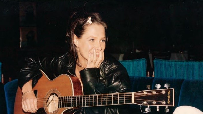 Kasey with her first proper guitar. Picture: Kasey Chambers / Supplied.