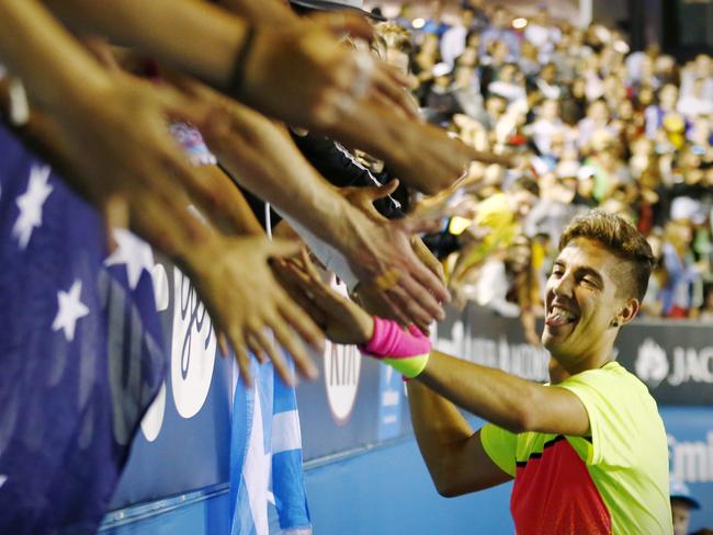 Kokkinakis celebrates with fans. Picture: Wayne Ludbey