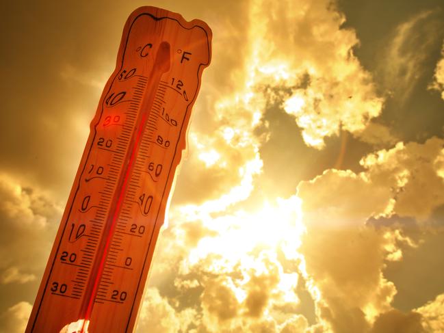 Melting street thermometer against bright summer sun.High temperature.Summer heat.Concept of global warming