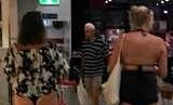 A Rockhampton shopper took this photo of two women in a shopping centre wearing bikinis which has split public opinion. Picture: Helen Day