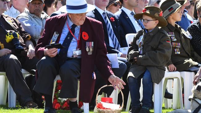 Young and old gathered to pay their respects. Picture: AAP Image/James Ross