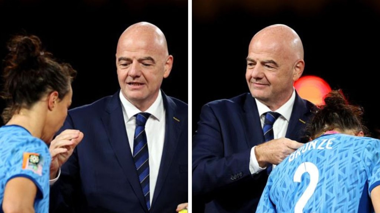 Lucy Bronze wasn’t interested in Gianni Infantino’s attempted handshake on the podium. (Photos by Catherine Ivill/Getty Images)