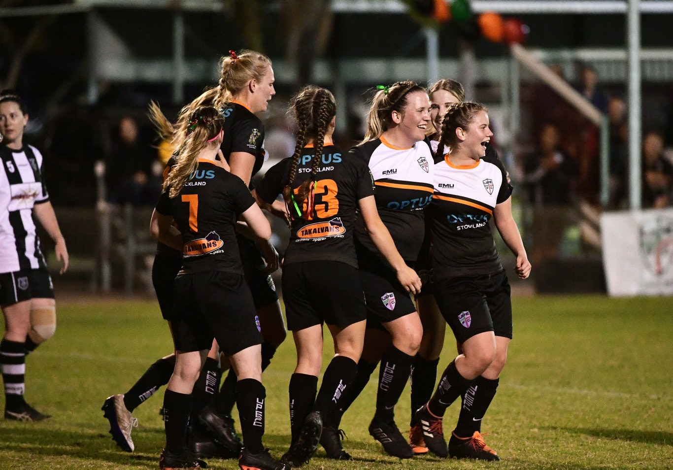 The UPE players celebrate a goal against Bingera at Martens Oval.