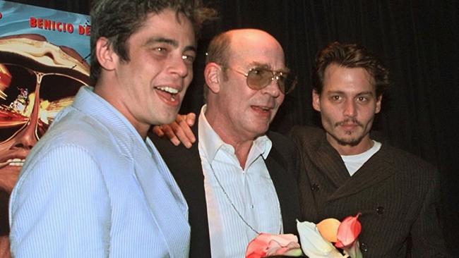 The actor was close friends with <i>Fear and Loathing in Las Vegas</i> author Hunter S. Thompson (centre). Credit: AP Photo/Kathy Willens.