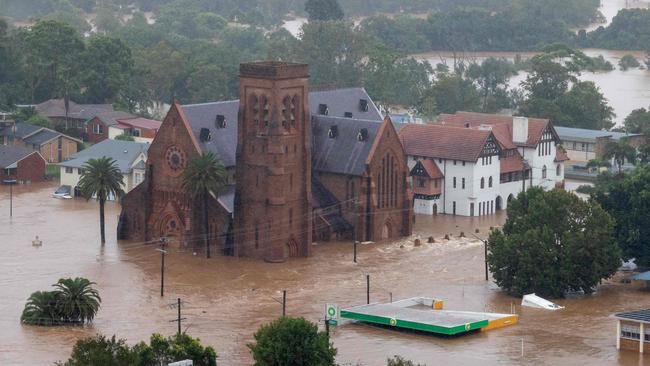 A handout photo taken on February 28 and released on March 3, 2022 shows an aerial view of a flooded church and other buildings in Lismore from an Australian Army helicopter taking part in Operation Flood Assist 2022. (Photo by Bradley RICHARDSON / Australian Defence Force / AFP)