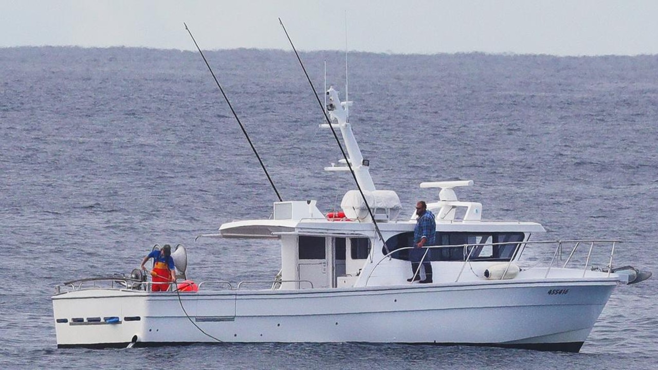 Contractors retrieve and replace damaged shark nets off Surfers Paradise after a successful whale rescue this morning. Picture: Glenn Hampson