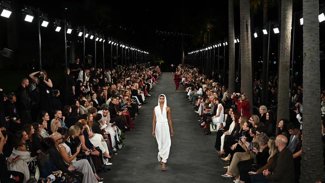 Models walk the runway during the Carla Zampatti show in Sydney’s Circular Quay on Monday. Picture: AAP