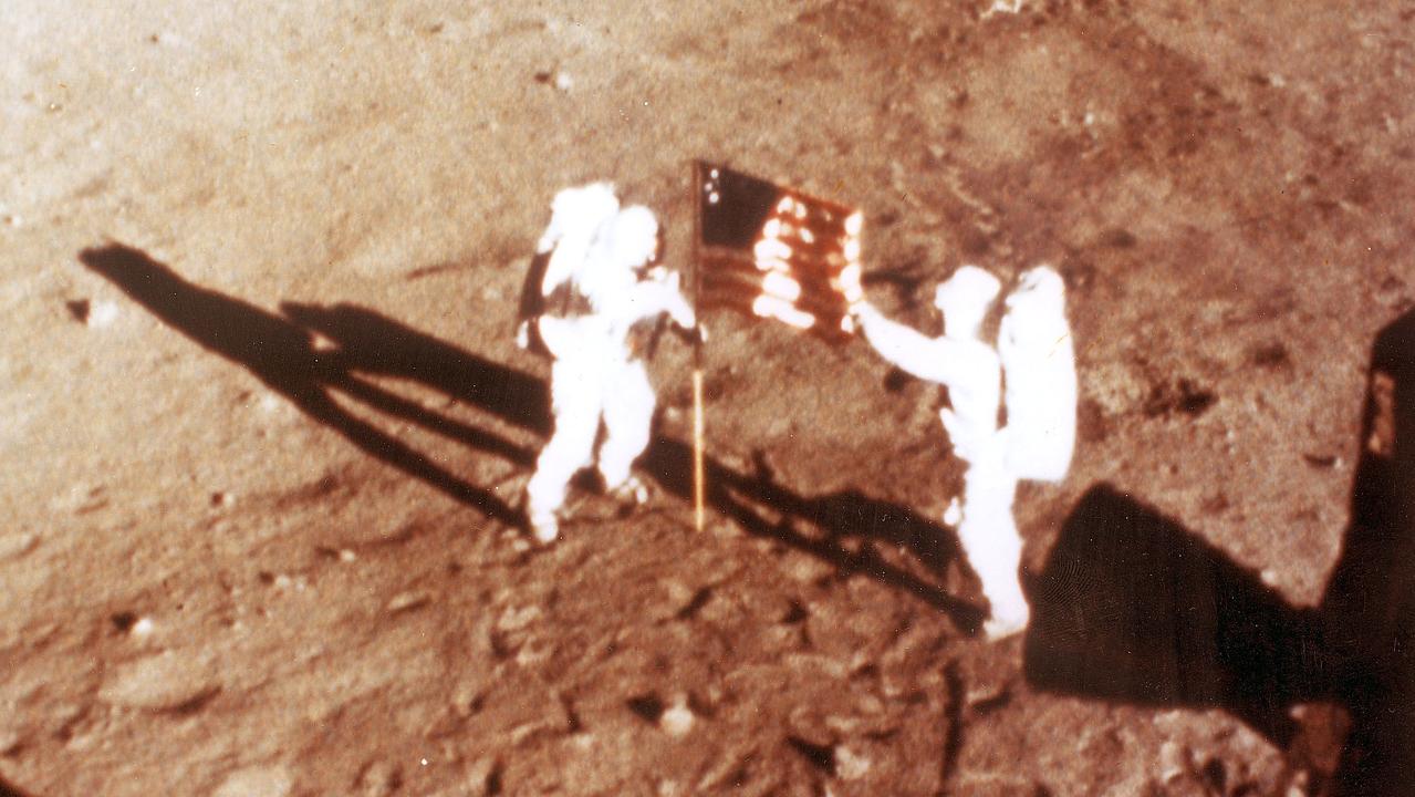 US astronauts Neil Armstrong and Buzz Aldrin plant the US flag on the lunar surface. Picture: AFP/NASA