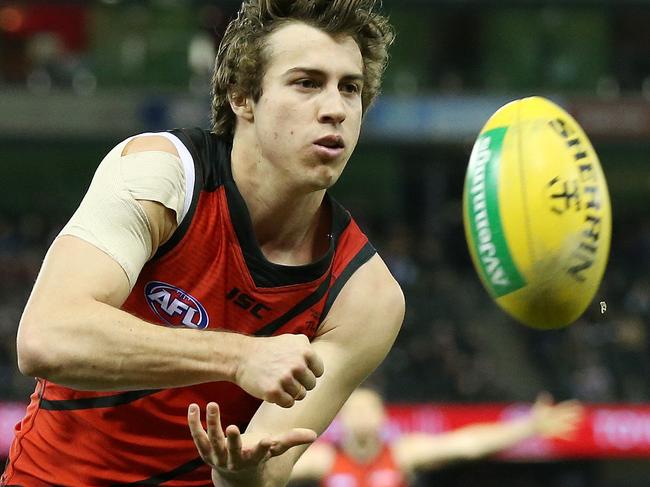 AFL Round 17. St Kilda vs. Essendon at Etihad Stadium. Essendon's Andrew McGrath handballs infant of St Kilda's Jack Steven   . Pic: Michael Klein