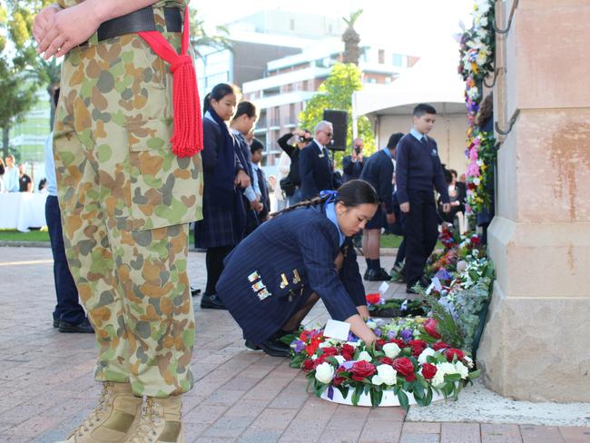 Local school children lay wreaths at the Burwood War Memorial Arch. Photoby Kate Christian