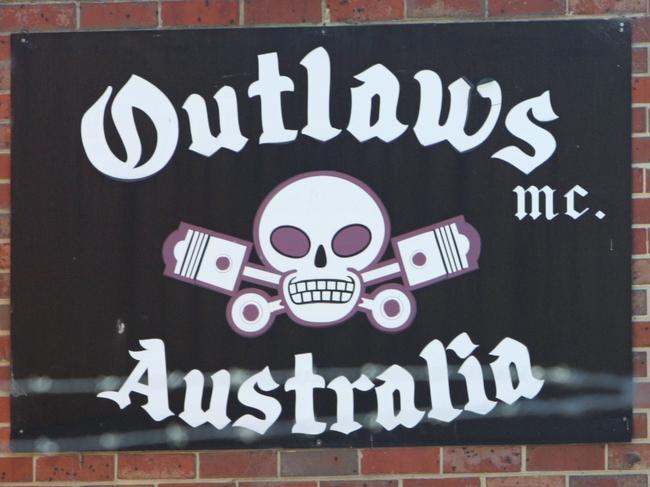 Police raid the Hastings branch of the Outlaws Motorcycle Club by blowing a hole in the side of club house wall.