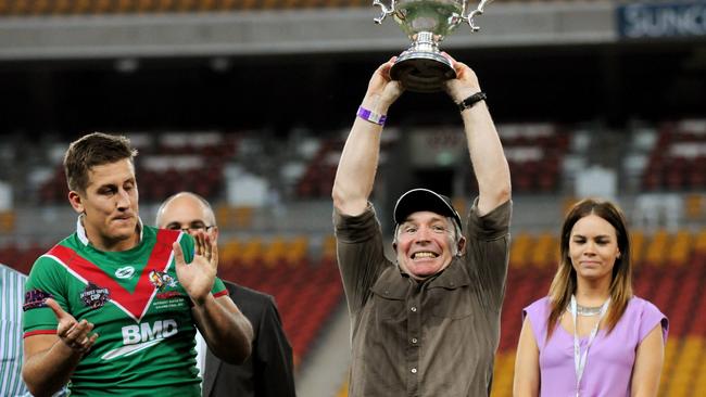 Wynnum coach Paul Green lifts the trophy alongside Luke Dalziel-Don in 2012.