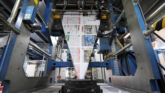 NT News paper is seen being printed at the print room in Darwin. The World Health Organisation says the risk of contracting coronavirus from touching paper or plastic is very low. Picture: Keri Megelus