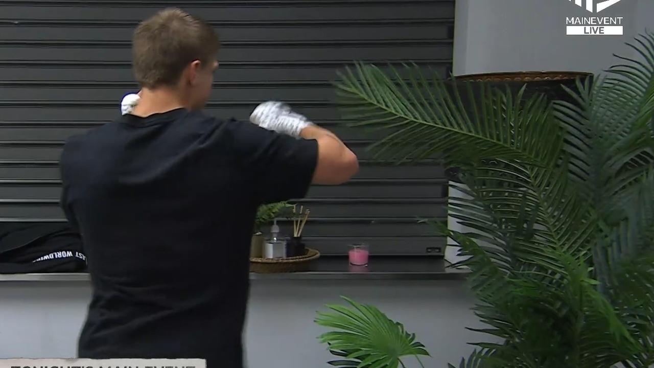 Nikita Tszyu spars with a pot plant backstage. Photo: Main Event.