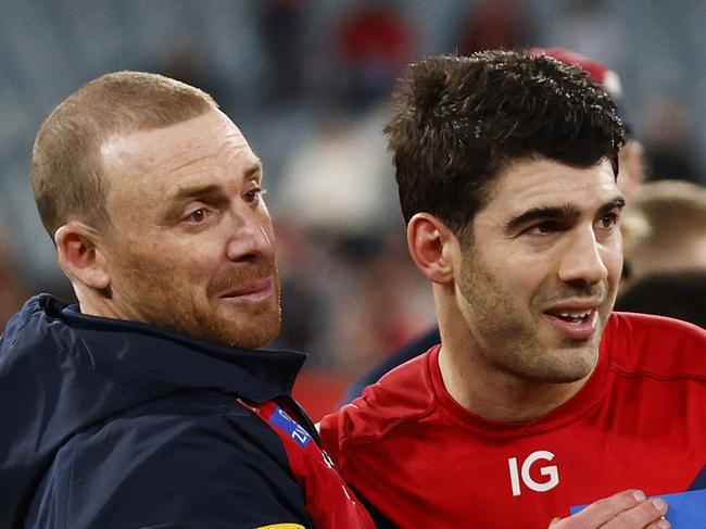 MELBOURNE, AUSTRALIA - JULY 23: Demons head coach Simon Goodwin (L) celebrates with Christian Petracca of the Demons (C) and Taj Woewodin of the Demons after winning the round 19 AFL match between Melbourne Demons and Adelaide Crows at Melbourne Cricket Ground, on July 23, 2023, in Melbourne, Australia. (Photo by Daniel Pockett/Getty Images)