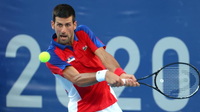 Novak Djokovic won three grand slam titles in 2021. Photo by Abbie Parr/Getty Images