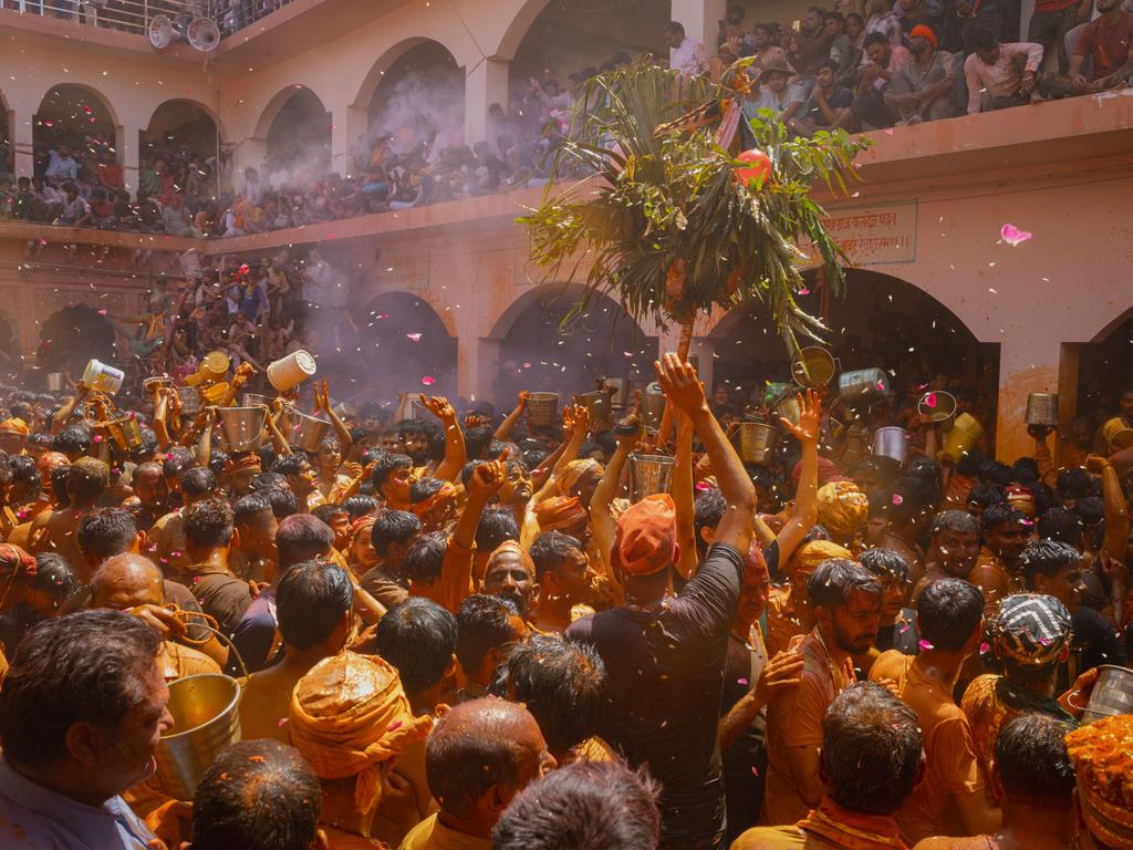 Hindu devotees throw water over each other at the Huranga festival, Dauji Temple near Mathura, marking the culmination of Holi festivities with dancing and drum-beating rituals.” Picture: Elke Scholiers/Getty Images