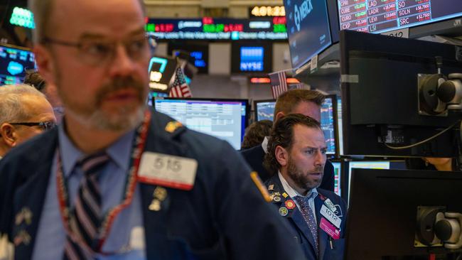 Traders working the floor of the New York Stock Exchange on January 31.