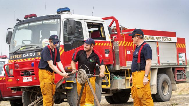 Fingal fire brigade volunteers Riley Plummer, Alex Johns and Paul Southworth during preparations on Saturday at Fingal, in Tasmania’s North. Picture: CHRIS KIDD