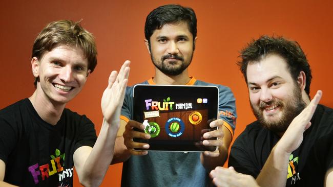 News-BCM 28.5.10 Brisbane boys (from left) Luke Muscat, 24, Shainiel Deo, 35, and Phil Larsen, 24, are delighted at the popularity of there i phone app Fruit Ninja which is in the top ten of apps around the world. Pic Tim Marsden Story Jorja Orreal.