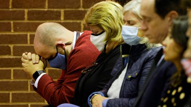 A man prays as people attend a mass in memory of Conservative British lawmaker David Amess, who was fatally stabbed, at Saint Peter's Catholic Parish of Eastwood. Picture: AFP