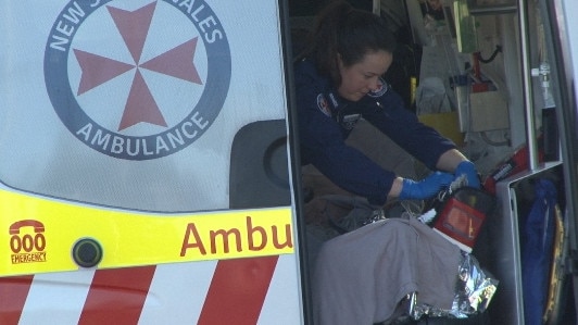 The Navy diver in the rear of an ambulance before he is placed aboard the CareFlight Rescue helicopter at Porter Reserve, Newport, for the flight to Prince of Wales Hospital at Randwick. Picture: TNV