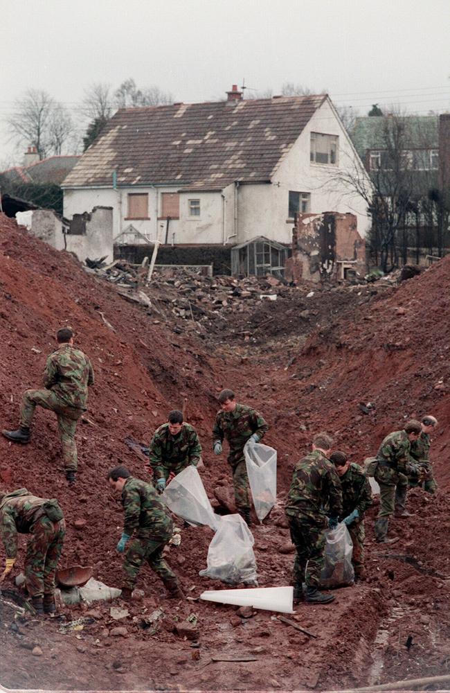 Soldiers search the crater left by the wreckage of PanAm flight 103 in the town of Lockerbie in 1988. Picture: AP