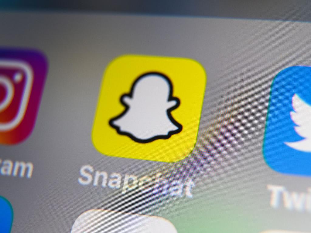 (FILES) This file photo taken on October 01, 2019, shows the logo of mobile app Snapchat displayed on a tablet in Lille. - US tech firm Snap on June 29, 2022, launched a subscription version of Snapchat as it looks to generate more money from the image-centric, ephemeral messaging app. (Photo by DENIS CHARLET / AFP)