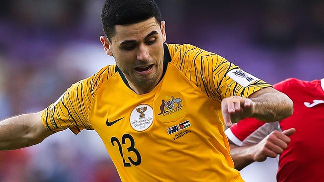 AL AIN, UNITED ARAB EMIRATES - JANUARY 06: Tom Rogic of Australia is challenged by Baha' Faisal of Jordan during the AFC Asian Cup Group B match between Australia and Jordan at Hazza Bin Zayed Stadium on January 06, 2019 in Al Ain, United Arab Emirates. (Photo by Francois Nel/Getty Images)