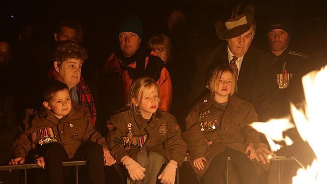 Children pay their respects. Picture: Hamish Blair