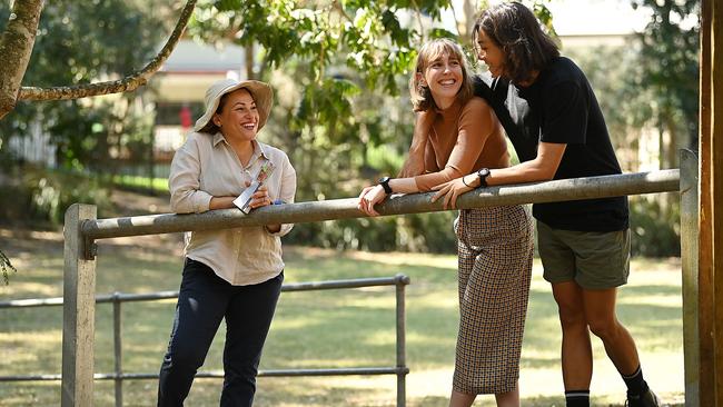 Jackie Trad talks with local voters Georgia Robertson and her partner Louis Yanagisawa as she door-knocks constituents in Highgate Hill, Brisbane. Picture Lyndon Mechielsen