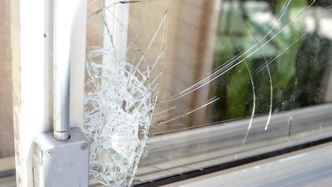 SHATTERED: The 29-year-old kicked in a window during an argument about back-paid rent. Picture: Wayne Lynnam