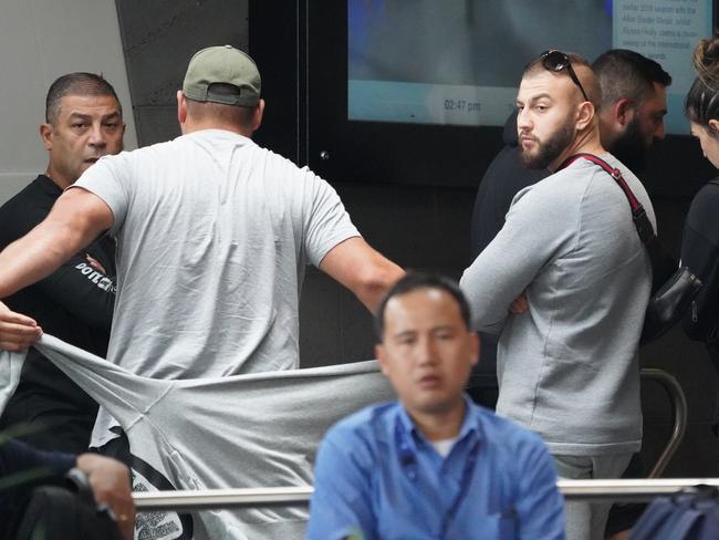 Tony Mokbel’s brother Horty Mokbel (left) and associates wait outside Royal Melbourne Hospital as the convicted drug kingpin undergoes surgery. Picture: AAP Image/Stefan Postles