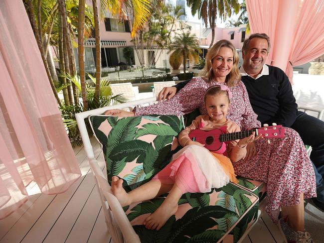 13/08/2019: Ray White Gold Coast agent Michael Willems and wife Dayna with Lulu their daughter at their Beverly Hills inspired property spanning two blocks at Main Beach, on the Gold Coast. The property has its own insta, @mainbeachbungalow, and is used for fashion shoots and influencer self-indulgence. Lyndon Mechielsen/The Australian