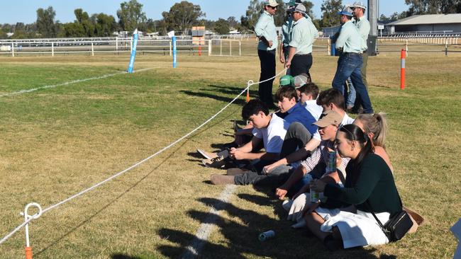 Spectators cheer on as they watch the B Grade St George vs Condamine match at the Roma Rugby Races at Bassett Park. Picture: Chloe Cufflin.
