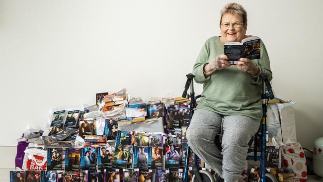 Kerin O'Sullivan is selling her large Mills and Boon collection. Picture: Lachie Millard