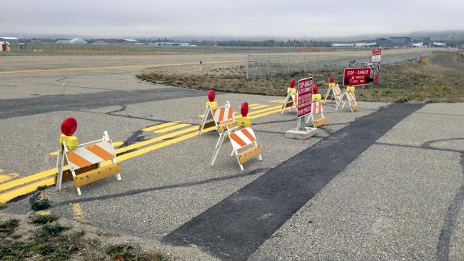 The barricaded entrance to a taxiway at Fairbanks International Airport. Picture: AP