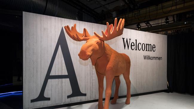 Wry reminder: Life-size orange elk greeting Benz’s guests at the reveal in Amsterdam.